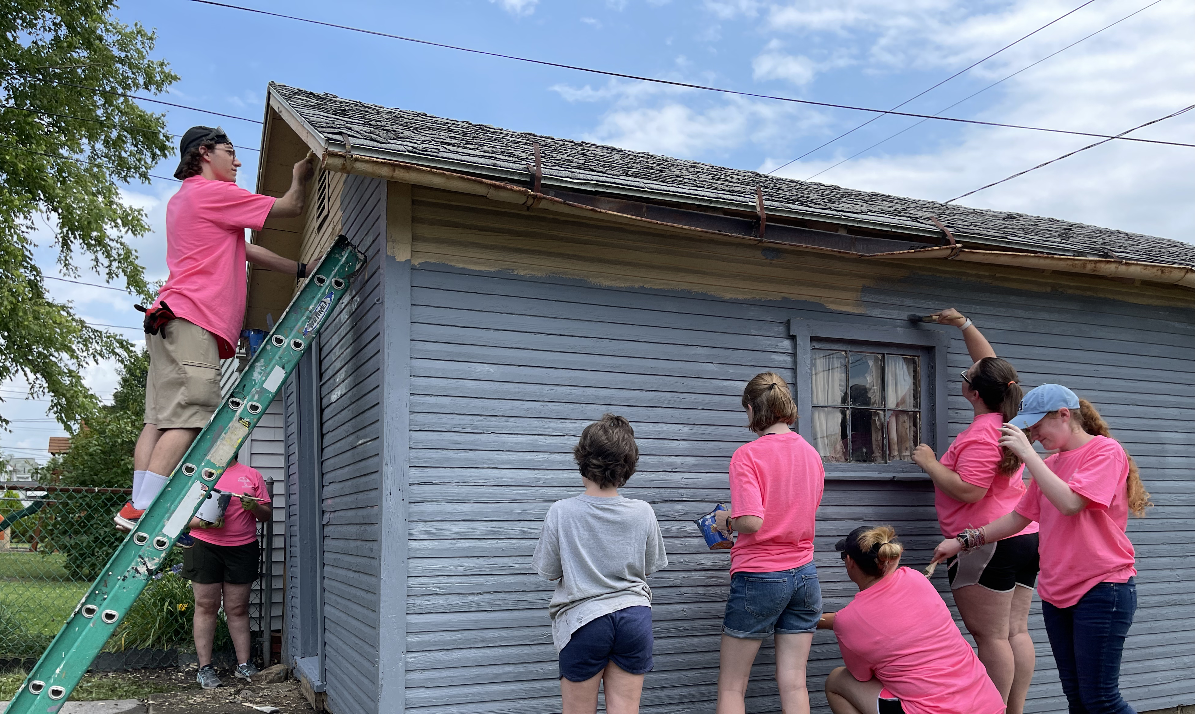 teens painting shed